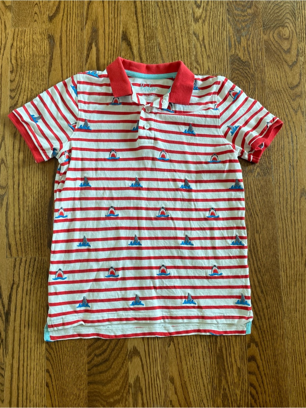 Boden stripe polo shirt with gray and blue shark accents, size 11-12 years